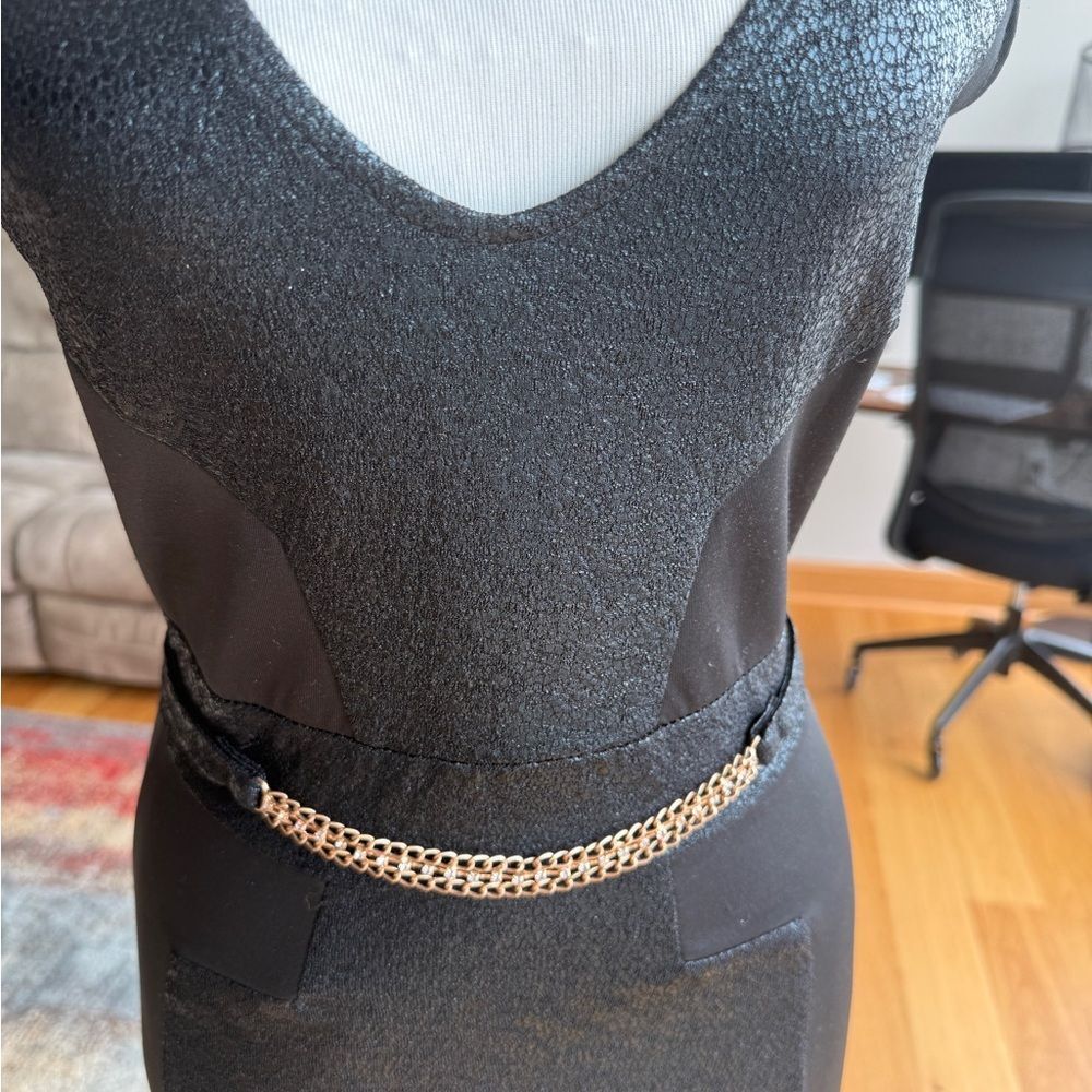 Elegant Black Dress with Gold Chain Accent